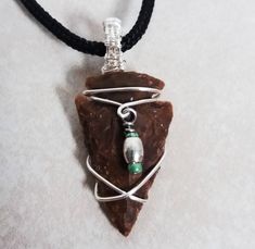 Wire Wrapped Agate Arrowhead Pendant - Unpolished Handcarved Agate Arrowhead with Woven Bail The pendant measures approximately 1.50 in x .75 in (50mm x 23mm). The stone measures approximately 1.00 in x .75 in (35mm x 23mm). Order comes with a free chain so that you can wear your pendant out of the box. PACKAGING:   Your purchase will be sent in a complimentary gift box, ready for gifting if your purchasing for someone else! If you are purchasing this item as a gift I can an add a little message and send it on your behalf. Just leave mailing address instructions at checkout. DELIVERY TIME: Domestic orders arrive within 2-8 business days. International shipments average 7-14 days, depending on customs in your country shipments could take longer. I ship via USPS First Class and delivery conf Dachshund Jewelry, Octopus Jewelry, Long Stone Necklace, Bible Verse Necklace, World Map Necklace, Octopus Pendant