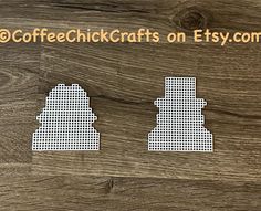 two pieces of cut out paper sitting on top of a wooden table with the words coffee chickcrafts on etsy com