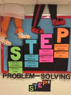 a bulletin board with shoes on it and words about the steps to help students learn