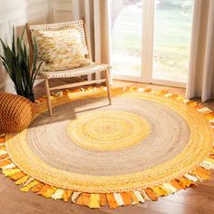 a living room with a chair and rug on the floor