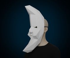 a man wearing a paper mask with his face cut out to look like a human head