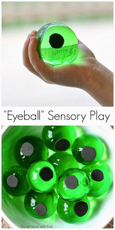 a hand holding a green ball with black dots on it and the words eyeball's sensory play