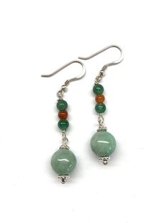 Green Jade Beads, Green Aventurine Beads, Jade Beads and 925 Sterling Silver Earrings.  A pair of dangling earrings with green jade beads, complemented by green aventurine beads and jade beads. Very beautiful and one of a kind!  - made with green jade beads, green aventurine beads and orange red jade beads, 925 sterling silver beads and 925 sterling silver wires and hooks - approximately 50 mm / 2 inches in length of the earrings - approximately 10 mm / 0.39 inches diameter of the green jade bea Jade Beaded Earrings For Jewelry Making, Jade Earrings With Gemstone Beads, Sterling Silver Dangle Earrings With Polished Beads, Sterling Silver Gemstone Bead Earrings, Sterling Silver Earrings With Polished Beads, Sterling Silver Earrings With Round Gemstone Beads, Jade Jewellery, Red Jade, Jade Earrings