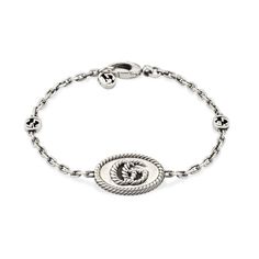 tyle ‎627749 J8400 0701The House's emblematic monogram appears in a twisted, torchon design on this sterling silver bracelet. Expertly made and intricately designed, often with subtle nods to the House, Gucci's silver jewelry collection is presented in an array of contemporary and classic pieces.925 Sterling silver with aged finishTorchon Double GEngraved torchon trim along the edgesClasp closure with Interlocking G charmCharm: .8" x .5"Made in Italy Flower Motifs, Gucci Jewelry, Jewelry Bracelets Silver, Sterling Silver Flowers, Silver Gifts, Silver Jewellery, Silver Watch, Silver Bracelets, Sterling Silver Bracelets