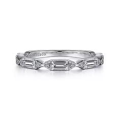 a white gold wedding band with baguetts