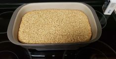 a casserole dish with oats in it on top of an oven burner