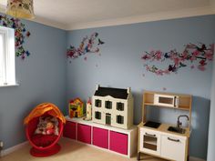 a child's play room with toys and furniture