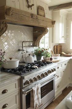 a kitchen with an oven, stove and counter top in it's center island