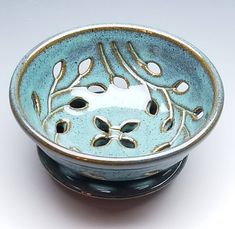 a blue and white bowl sitting on top of a table