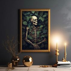 there is a painting on the wall with a skeleton in it and candles next to it