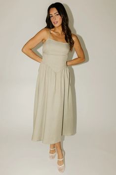 this vintage-inspired olive midi dress is a coquette aesthetic dream. featuring a subtle sweetheart neckline + a smocked corset-inspired bodice, it’s the perfect spring // summer midi dress for any occasion. dress it up with heels + loafers, or down with ballet flats + sneakers.  olive // midi length, subtle sweetheart Square Neck Maxi Dress For Date Night, Midi Dress With Ruched And Fitted Bodice For Brunch, Date Night Maxi Dress With Square Neck, Summer Midi Dress With Pleated Bodice And Sweetheart Neckline, Sundress Midi Dress With Smocked Back For Date Night, Knee-length Midi Dress With Ruched Bodice For Summer, Ruched Midi Dress With Sweetheart Neckline For Daywear, Sweetheart Neckline Midi Dress With Ruched Detail For Daywear, Fitted Midi Dress With Natural Waistline For Summer