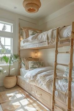 a bedroom with bunk beds and windows in it