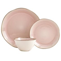 a pink and white dinnerware set on a white background