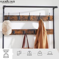 a coat rack with hooks and hats hanging from it's sides next to a bag