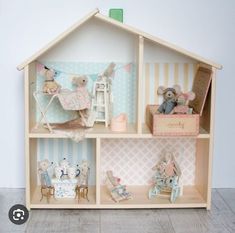 a doll house with teddy bears in it