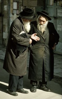 two old men standing next to each other