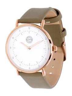 a white and brown watch on a tan leather strap with rose gold accents in front of a white background