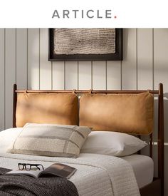 a bed that has some pillows on top of it and the words article above it