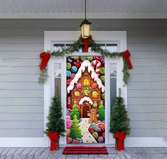 a decorated front door with christmas decorations on it