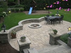 an outdoor patio with seating and fire pit