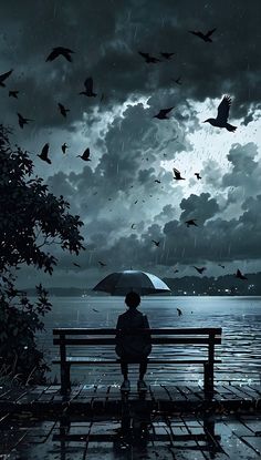 a person sitting on a bench in the rain with an umbrella and birds flying overhead