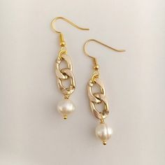 "Gold chain and pearl drop earrings. Chunky chain links are adorned with ivory freshwater pearls. Ultra modern and lightweight, these dangly charmers are going to be your favorite special occasion ear adornment. Sophisticated yet edgy take on the traditional pearl earring. They're the perfect length and sure to coordinate with any many different outfits and styles. Get in on the pearlcore trend! Earrings are approximately 1.75\" in length, gold plated, and on French earwires. Color may vary slig Diy Earrings Pearl, Drop Earrings Simple, Etsy Promotion, Beaded Jewelry Tutorials, Link Earrings, Handmade Fashion Jewelry, Earrings Inspiration, Earrings Simple, Chic Jewelry