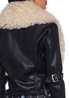 you're the talk of the town. This cropped moto jacket has a vegan leather construction, statement faux fur trim, buckle strap details, and a front zip closure with a crown logo charm. Trendy Belted Biker Jacket For Winter, Black Biker Leather Jacket With Faux Fur Trim, Winter Biker Outerwear With Belt, Winter Biker Style Belted Outerwear, Trendy Fitted Leather Jacket With Faux Fur Trim, Edgy Belted Biker Jacket For Winter, Winter Black Belted Biker Jacket, Chic Faux Fur Biker Jacket For Fall, Fitted Black Biker Jacket With Faux Fur Trim