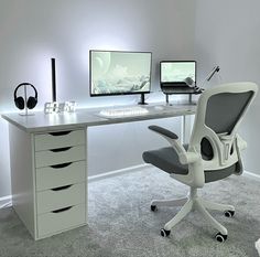 an office desk with two computer monitors and a chair in front of it, on carpeted floor