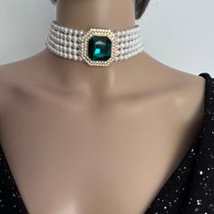 Make a statement with this Layered Pearl Choker Necklace with 5 layers of pearls and stunning green diamanté brooch. Materials: 6mm Luxurious Shell Pearls, Green rhinestones brooch, Gold plated brass clasp. Shell pearls are made from crushed shells. Oyster shells are cut and transformed into powder and then reformed into perfect pearl shape with an infinite shine. They are very popular as a natural alternative to expensive pearls.  Each glossy bead is crafted to mimic the radiant beauty of real Formal Green Pearl Necklaces, Formal Green Pearl Necklace, Vintage Pearl Choker For Party, Vintage Pearl Choker Jewelry, Evening Pearl Choker Necklace, Green Pearl Jewelry For Party, Elegant Green Pearl Bridal Necklace, Elegant Green Bridal Choker Necklace, Green Pearl Necklace For Party