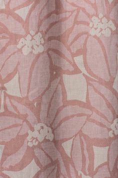 a pink and white flower print curtain