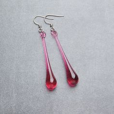 "These long pink teardrop earrings are made of glass in lampwork technique. The stainless steel hooks are hypoallergenic, they will not tarnish, fade, or discolor with time. These unique and beautiful earrings are simple and elegant, very lightweight and comfortable to wear, perfect for everyday wear and for special occasions. 💕 You will definitely receive lots of compliments on your new earrings, everybody loves them, and you'll love them too! Dimensions: total length about 2 3/4\" inch (67 mm Pink Teardrop Earring, Pink Drop Earrings With Ear Wire, Pink Hypoallergenic Teardrop Earrings, Handmade Adjustable Pink Teardrop Earrings, Pink Teardrop Metal Earrings, Handmade Pink Teardrop Crystal Earrings, Pink Tarnish-resistant Drop Earrings, Black Statement Earrings, Glass Drop Earrings