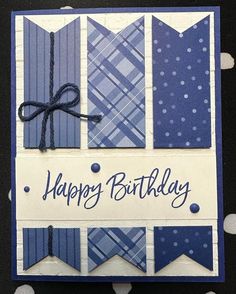 a happy birthday card with blue and white plaid designs on it's front side