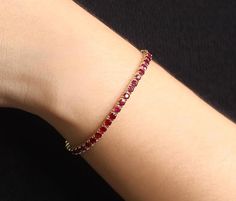 > Ruby Bracelet (July Birthstone)> Metal: 14K Solid Gold (White and Yellow Gold)> Ruby Total Carat Weight: 6.5 ct.> Width of Ruby: 3.5mm / each(Total Ruby quantity varies with the length)> Stone Quality: 100% Natural Ruby> Handmade in the United States Ruby Necklace Designs, Bracelet Tennis, Gold Chain Design, Ruby Bracelet, Accesories Jewelry, Emerald Bracelet, Birthstone Bracelet, Red Bracelets, Ruby Necklace