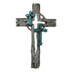 an old wooden cross with turquoise accents