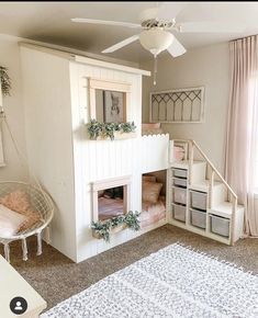 a child's bedroom with a loft bed and stairs to the second floor is shown