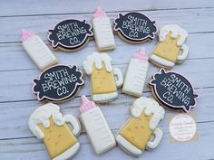 decorated cookies are arranged in the shape of beer mugs