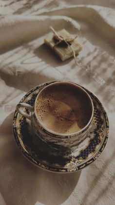 a cup of coffee sitting on top of a saucer