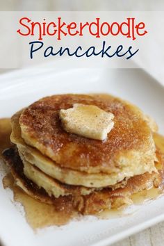 a stack of pancakes with butter on top and syrup in the middle, sitting on a white plate