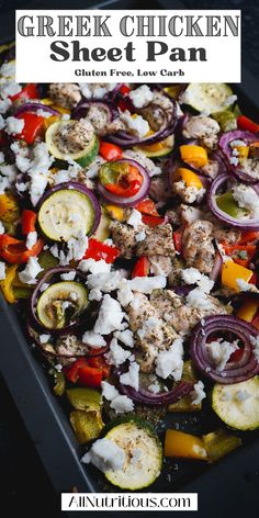 greek chicken sheet pan with onions, zucchini and peppers in it on a baking sheet