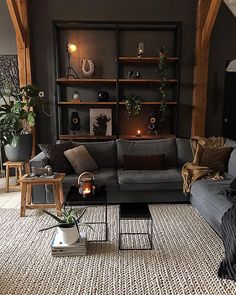 a living room filled with furniture and lots of bookshelves on top of it