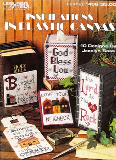 the front cover of an old book with cross stitching on it and other items