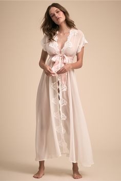 Semi-sheer white chiffon is trimmed in elegant lace rosettes and cinched with a blush satin sash, giving this boudoir staple a look that’s as sultry as it is sophisticated. Bridal Robe | Wedding Day Getting Ready | #homebodii #bridalrobe #weddingday Southern Curls And Pearls, Robe Wedding, Lingerie Design, Anthropologie Wedding, Satin Sash, White Chiffon