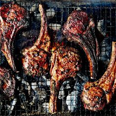 steaks being grilled on a grill top