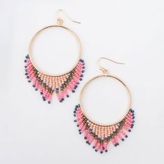 Playful and cute, the Irie Beaded Chandelier Hoop Drop Earrings feature big golden hoops with cascading rows of intricate beadwork. If you're looking for a way to add color to your wardrobe, this is it! These beautiful dangle earrings come with fish hooks with rubber backs, keeping your earrings securely in place. Our Earrings are perfect for any age range and would make beautiful gift for any occasion and easily accentuates any style. Looking for the perfect gift? Our unique earring jewelry des