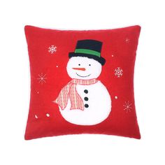 a red pillow with a snowman on it