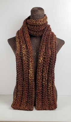 This scarf will keep you cozy and stylish in cold Winter weather. Measures 70 inches long and 5 inches wide.  Can be worn multiple ways. Made with a chunky wool blend yarn for warmth and easy care.  Machine washable.