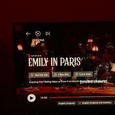 a television screen with the words family in paris on it and an image of two people sitting at a table