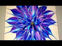 a painting with blue and purple flowers on it