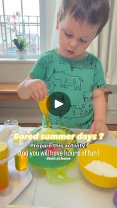 a little boy that is standing in front of a bowl