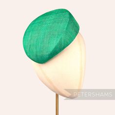 Betty is what we like to call a modern pillbox. Instead of having straight sides, this emerald hat base has a gentle slope to one side and finishes off at a slight point. It looks great positioned at many angles and is finished on the inside with a petersham ribbon edge.  Can be attached to the head with elastic, hair comb or headband (not included). Measurements: Width: 16.5x18.5cm (6.4x7.2 inches) Height at tallest ridge: 5.5cm (2.1 inches) We have hundreds of different hat bases available! To Elastic Hair Comb, Sinamay Fabric, Sinamay Fascinator, Blank Hats, Millinery Supplies, Hat Base, Different Hats, Head Gear, Velvet Flowers